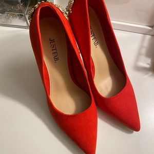 Cherry red pumps with gold embellished heel